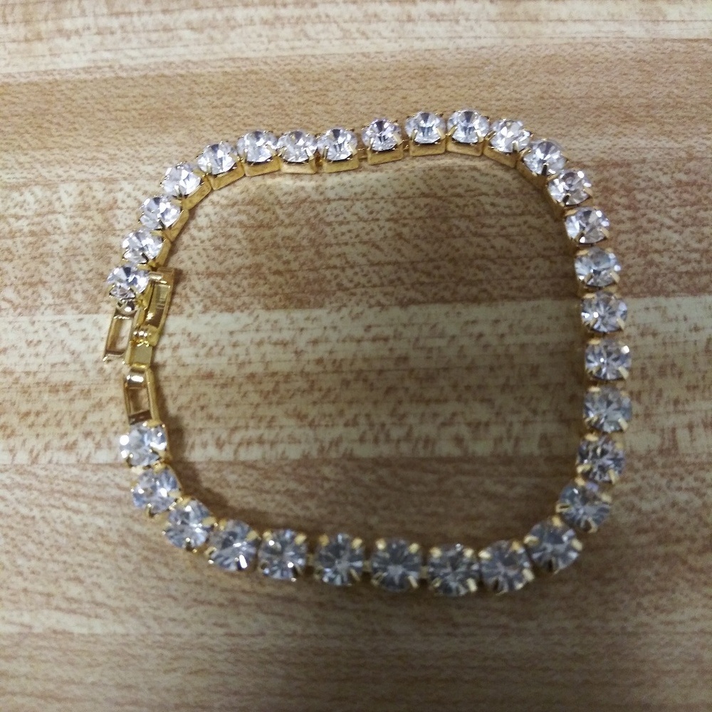 18k Yellow Gold Iced Out Single Row Bracelet.